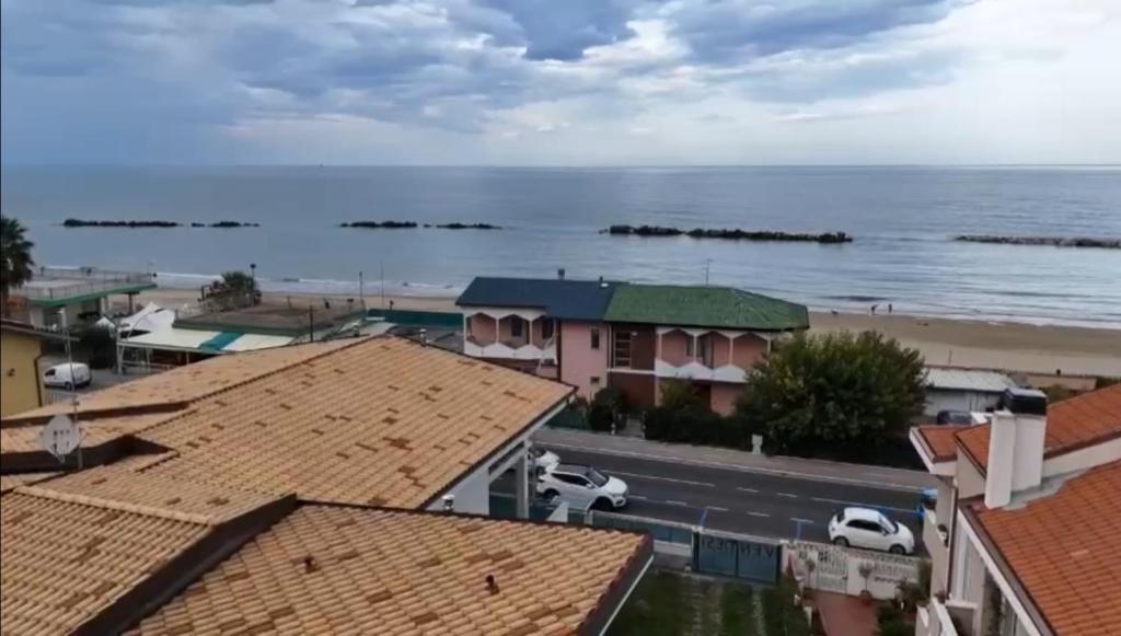 a view of the ocean from the roofs of houses at Magnolia in Francavilla al Mare