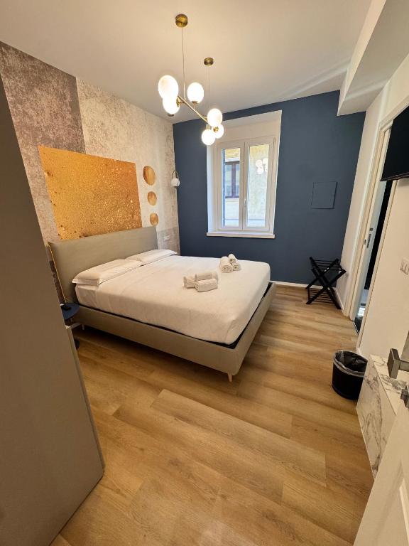 Postel nebo postele na pokoji v ubytování Maison Rasella Palace Suites