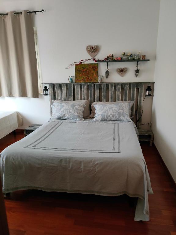 Postel nebo postele na pokoji v ubytování Vistazzurra B&B