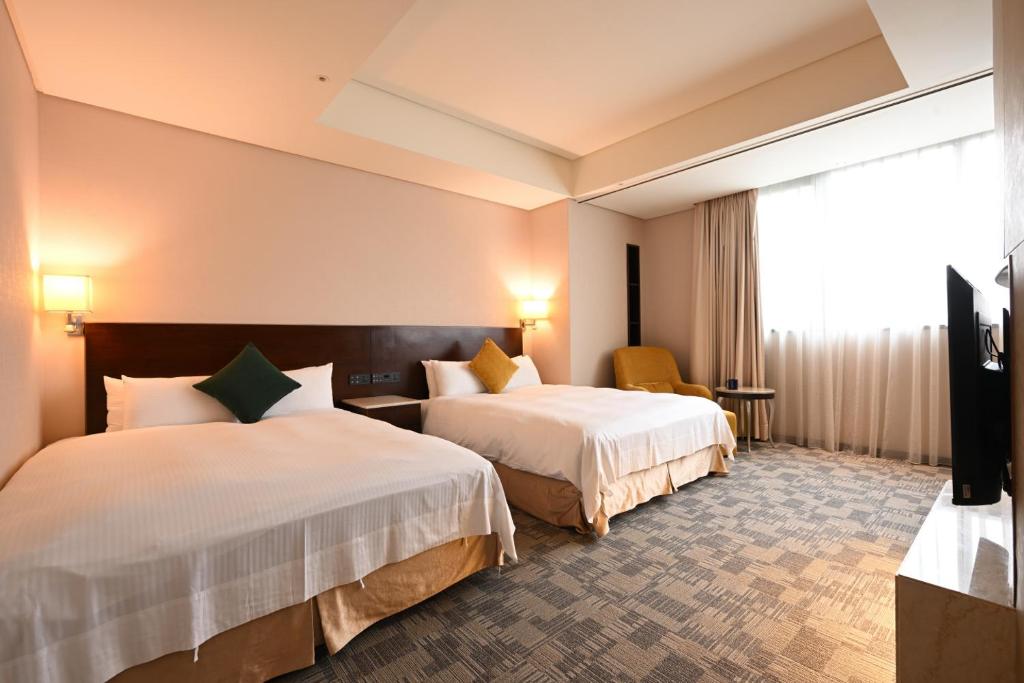 Postel nebo postele na pokoji v ubytování Via Hotel Breeze