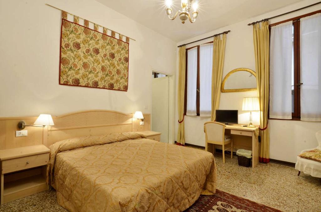 Postel nebo postele na pokoji v ubytování Ca' Turelli Dimora Storica