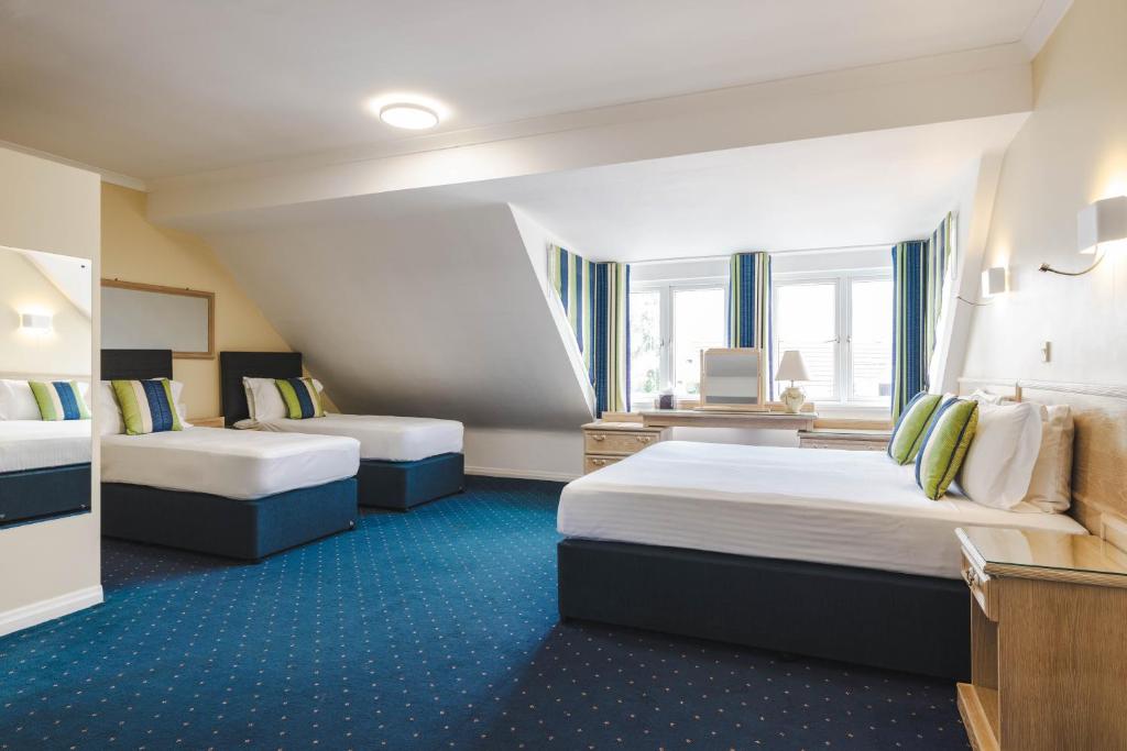 Postel nebo postele na pokoji v ubytování Beausite Hotel