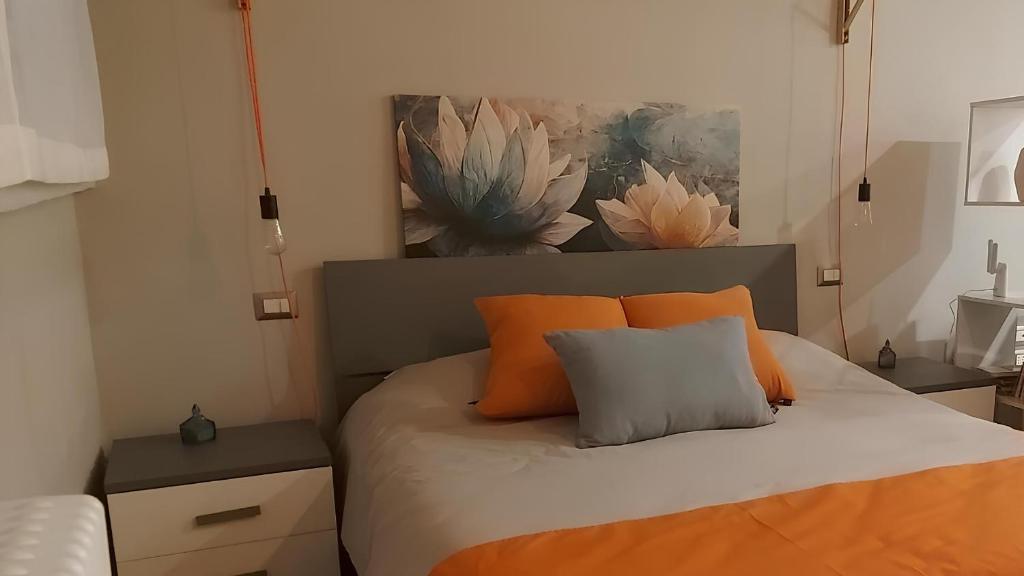 Ένα ή περισσότερα κρεβάτια σε δωμάτιο στο I Tre Cuori