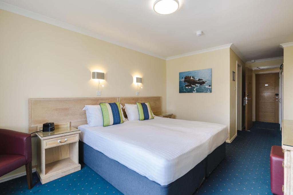 Postel nebo postele na pokoji v ubytování Beausite Hotel