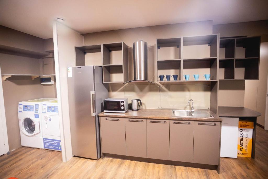 Kuchyň nebo kuchyňský kout v ubytování Hostel K3a