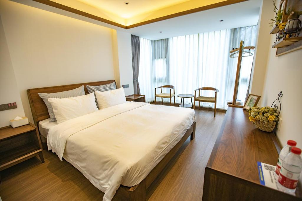 Postel nebo postele na pokoji v ubytování Shanghai Liudi Mingshe Boutique Bed and Breakfast