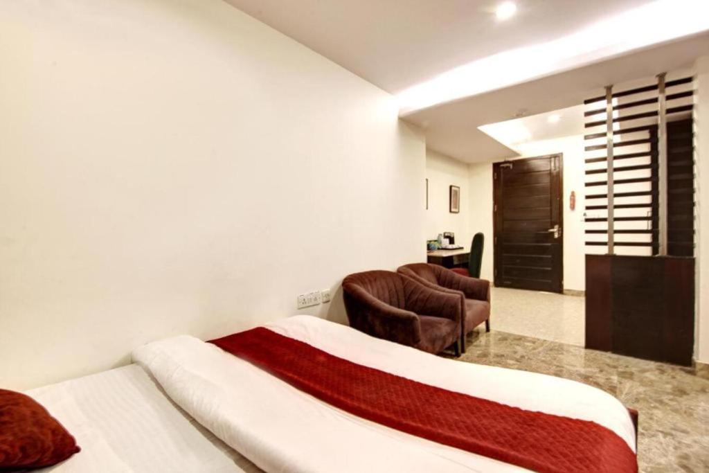Postel nebo postele na pokoji v ubytování Hotel Aeron Paharganj