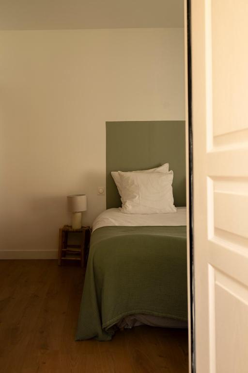Postel nebo postele na pokoji v ubytování Maison Cachée - Chambres et Appartements en Baie de Somme