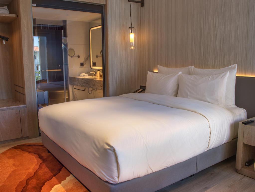 Postel nebo postele na pokoji v ubytování Hotel dua Kenting