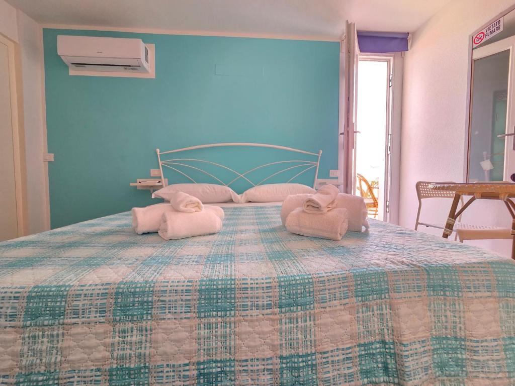 Postel nebo postele na pokoji v ubytování B&B Litoranea 80