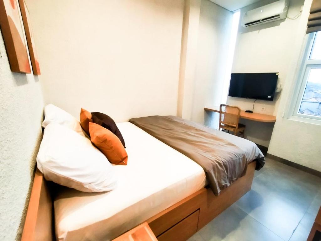 Postel nebo postele na pokoji v ubytování Casa de Java Cirebon