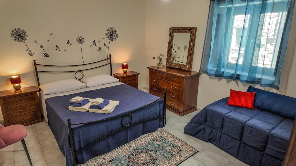 Кровать или кровати в номере Asteria Guest&Artist House - Casa Talìa