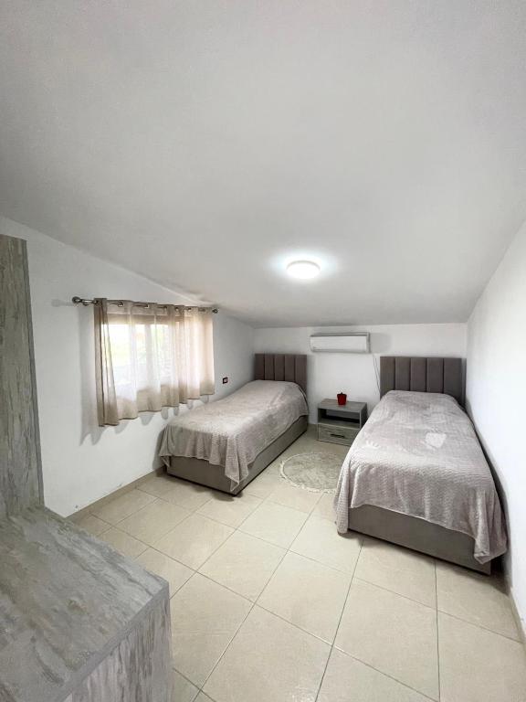 Postel nebo postele na pokoji v ubytování Prela's Rooms