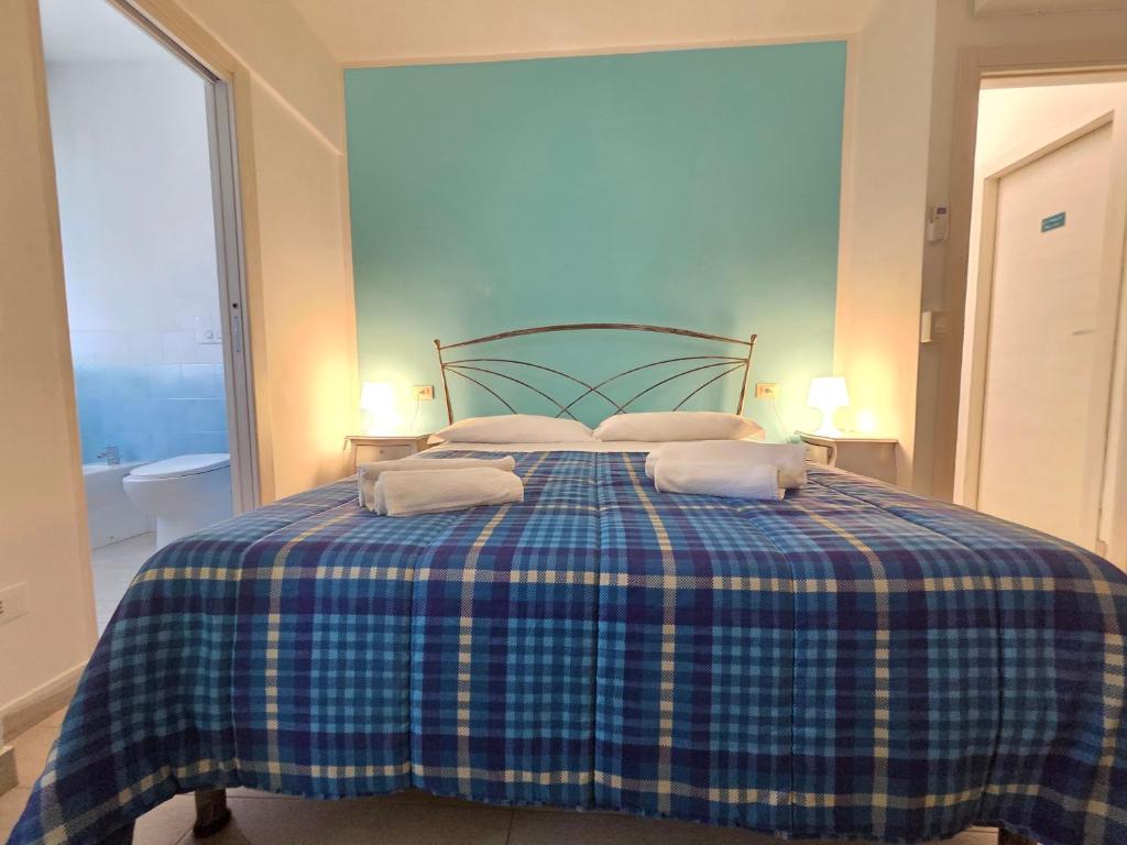 Postel nebo postele na pokoji v ubytování B&B Litoranea 80