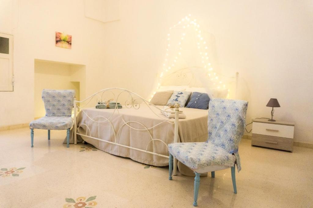 En eller flere senge i et værelse på Casa dei Fiori