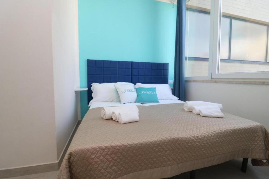 Postel nebo postele na pokoji v ubytování B&B Litoranea 80