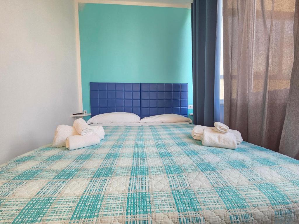 Postel nebo postele na pokoji v ubytování B&B Litoranea 80