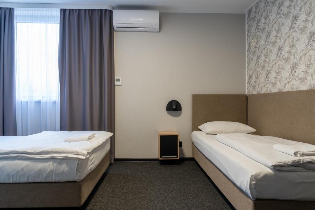 Posteľ alebo postele v izbe v ubytovaní Noclegi Stop and Sleep Zgorzelec