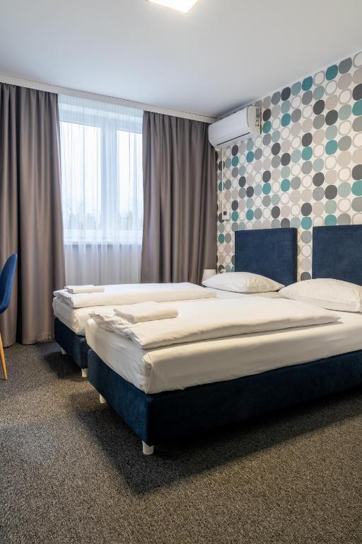 Posteľ alebo postele v izbe v ubytovaní Noclegi Stop and Sleep Zgorzelec