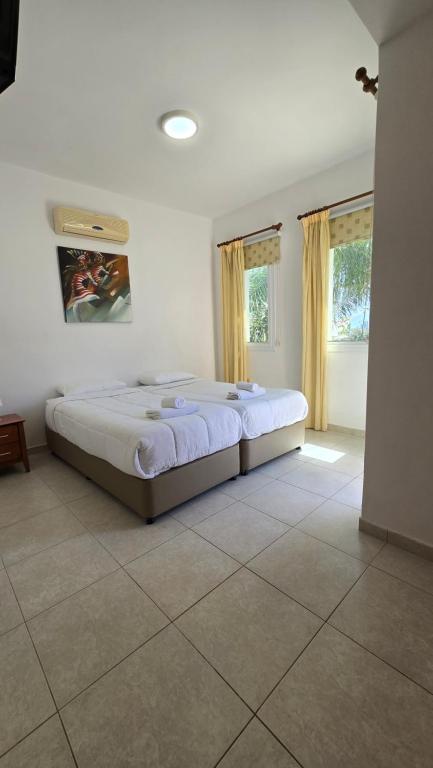 Postel nebo postele na pokoji v ubytování Villa Alkioni 31