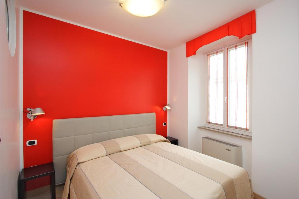 Postel nebo postele na pokoji v ubytování Hotel Roma