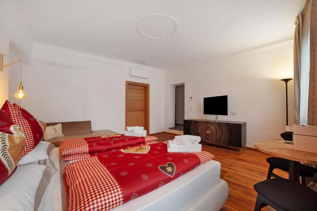 Postel nebo postele na pokoji v ubytování Boutique Hotel Santer Klause