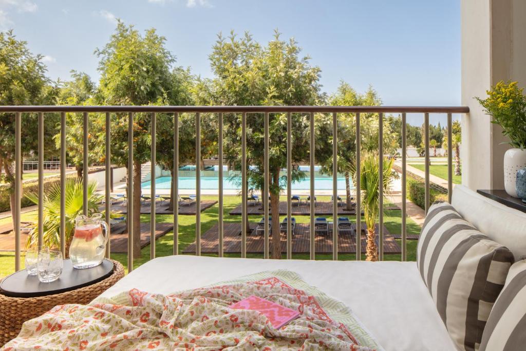 a balcony with a view of a pool at Victoria Golf Resort and Spa Managed by Accor in Vilamoura