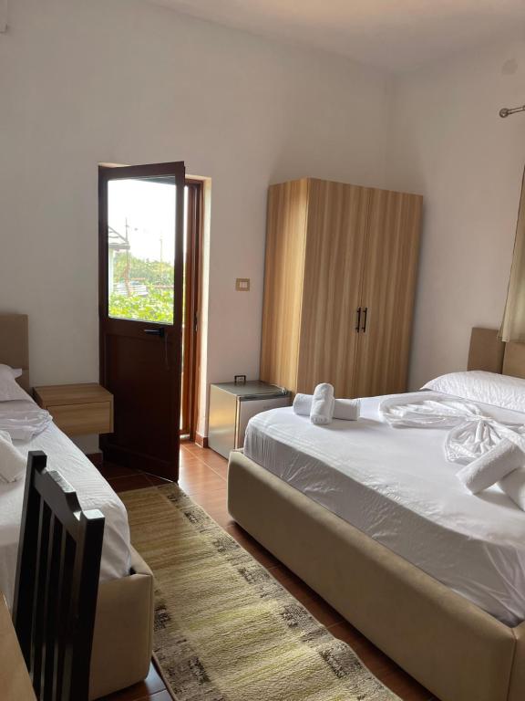 Postel nebo postele na pokoji v ubytování Prela's Rooms