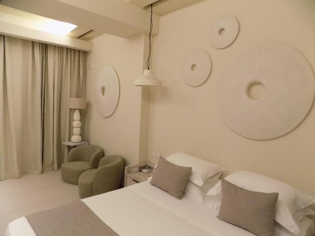 Postel nebo postele na pokoji v ubytování Sea Nymphs Suites