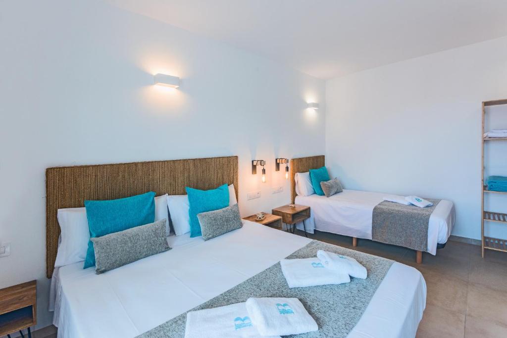 Postel nebo postele na pokoji v ubytování Bamblue Boutique Apartments
