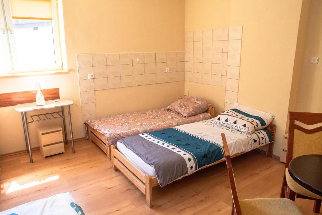 Łóżko lub łóżka w pokoju w obiekcie Dom nad Wisła
