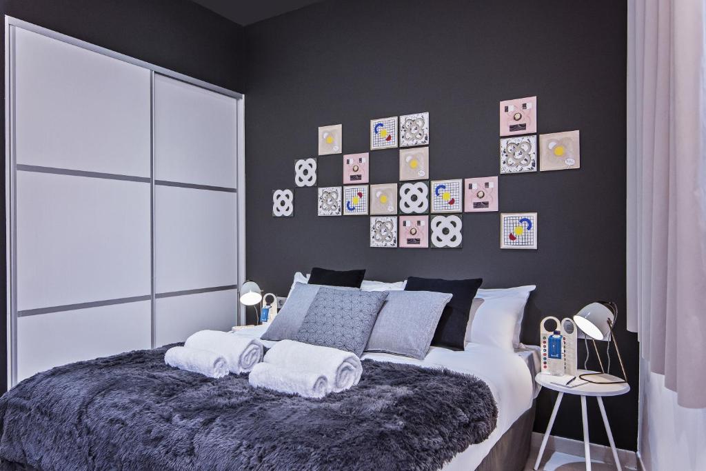 Postel nebo postele na pokoji v ubytování Sweett - Sants