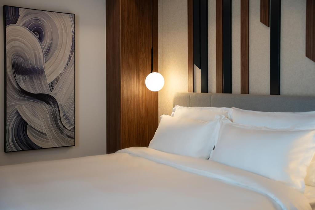 Postel nebo postele na pokoji v ubytování Hotel Rubin DHS