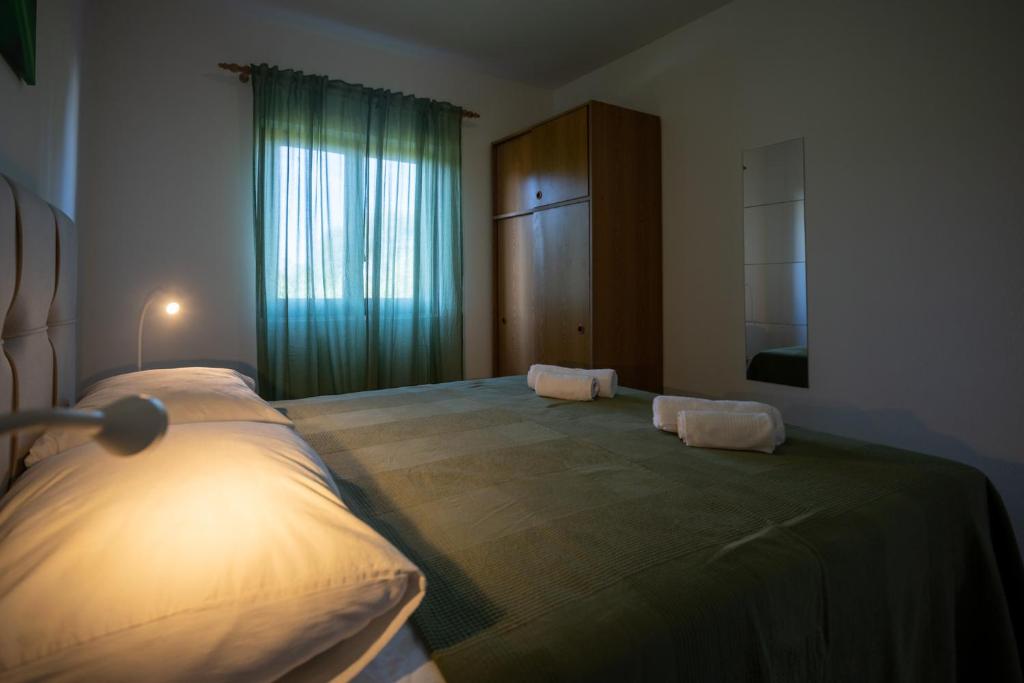 Postel nebo postele na pokoji v ubytování Apartments Gaja Green ap