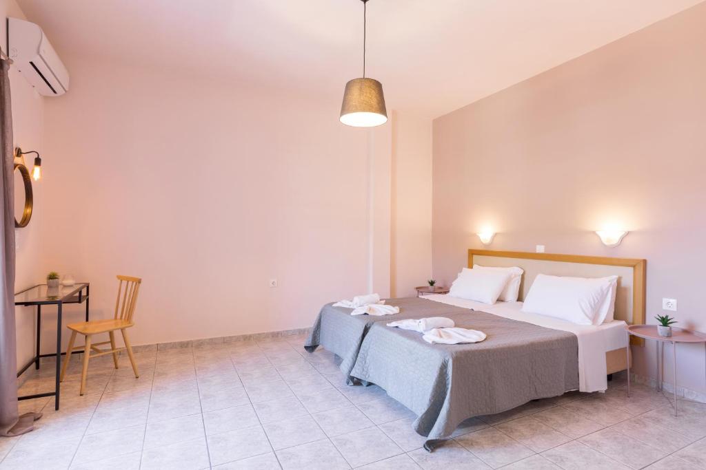 Postel nebo postele na pokoji v ubytování Garden Budget Rooms