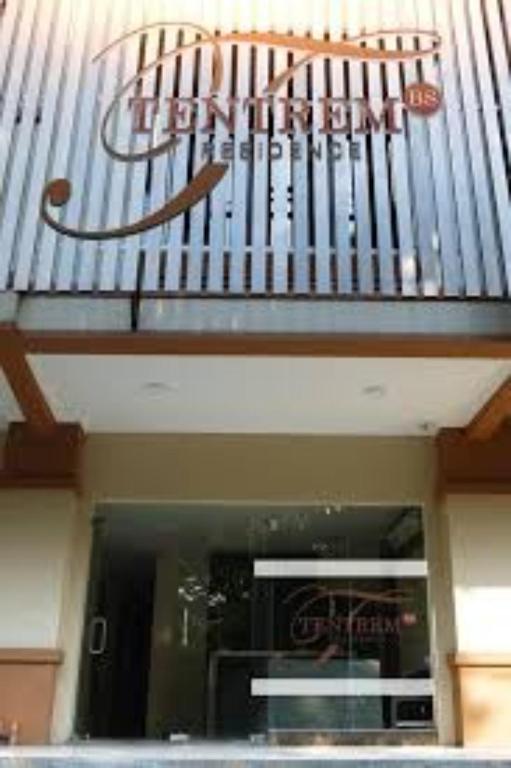 a store front with a sign above a window at Tentrem BS Residence in Semarang