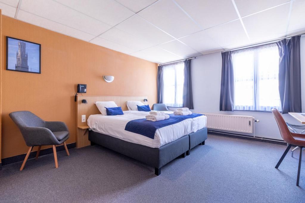 Postel nebo postele na pokoji v ubytování Hotel Montovani