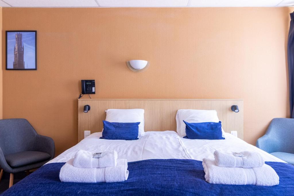 Postel nebo postele na pokoji v ubytování Hotel Montovani