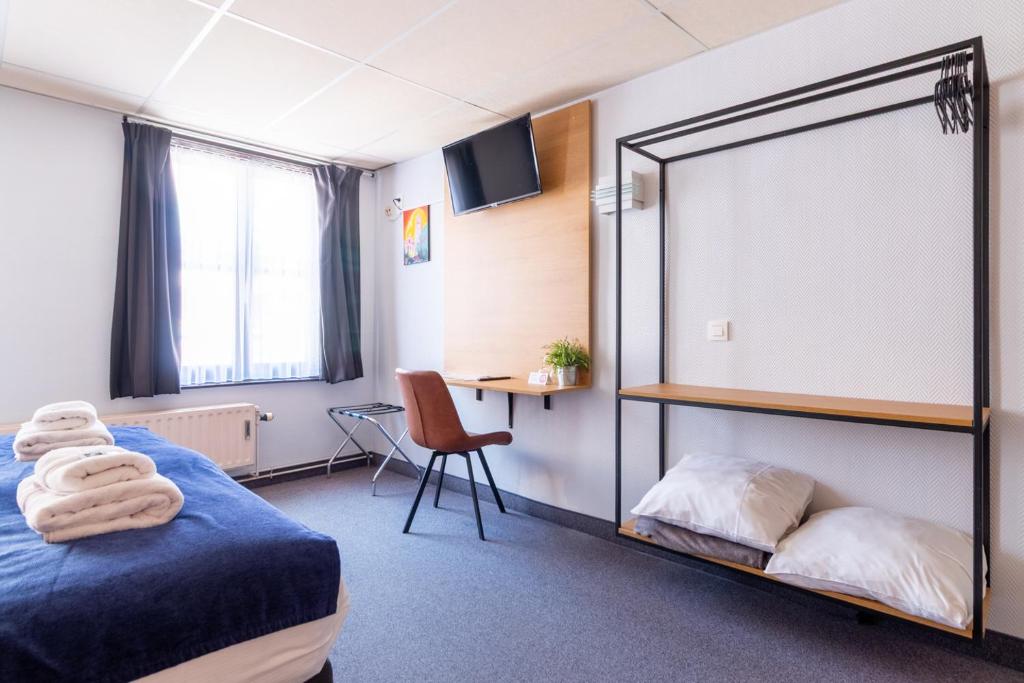 Postel nebo postele na pokoji v ubytování Hotel Montovani