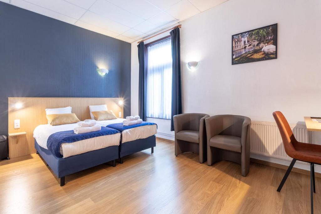 Postel nebo postele na pokoji v ubytování Hotel Montovani