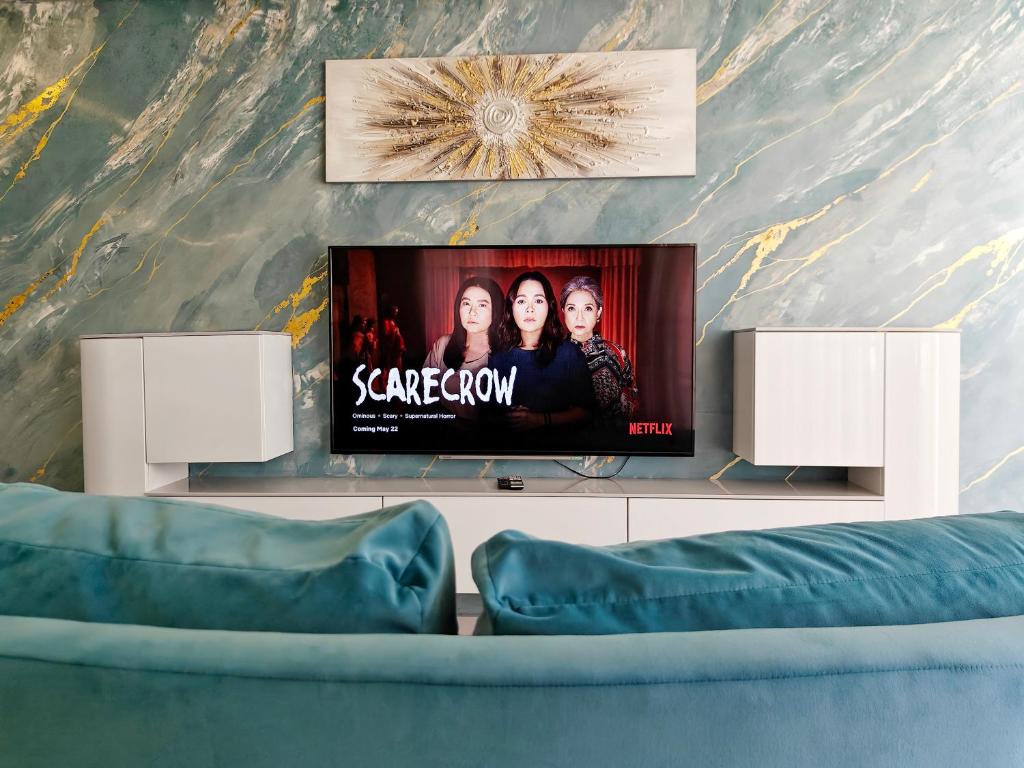 TV a/nebo společenská místnost v ubytování BluSky