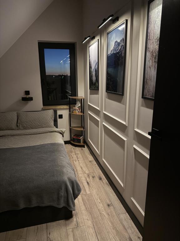 Una cama o camas en una habitación de Golden House - Mazury