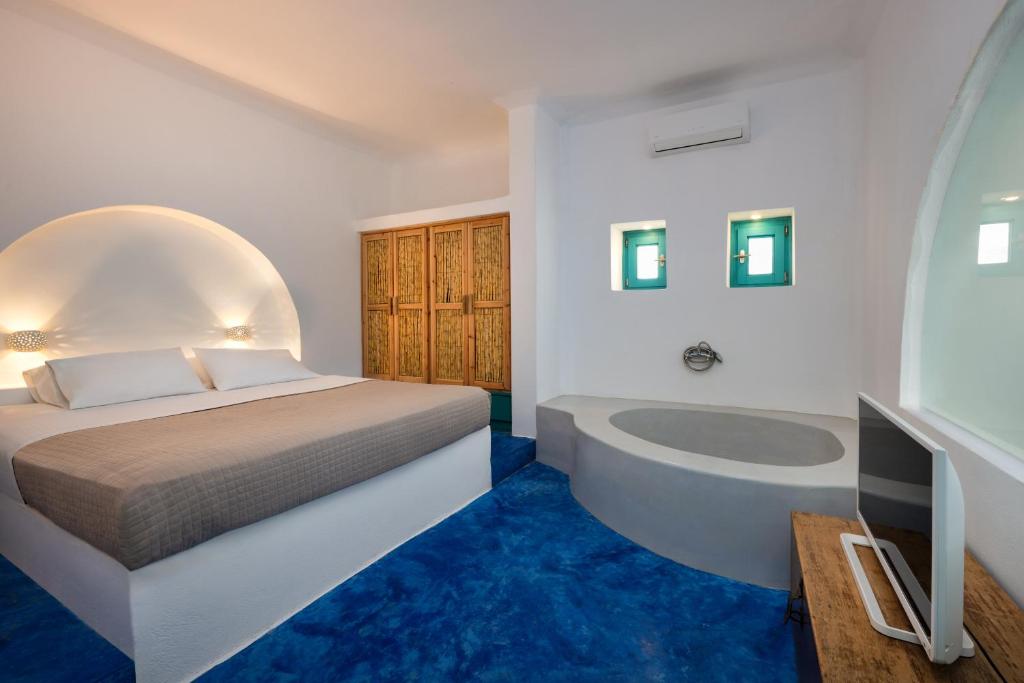 Postel nebo postele na pokoji v ubytování Nissia Beach Apartments & Suites