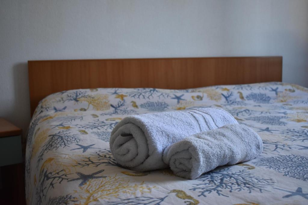 A bed or beds in a room at Appartamenti San Teodoro