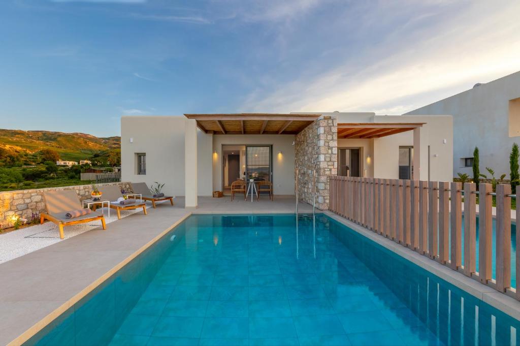 a villa with a swimming pool and a house at Casa Tierra - Villa II in Kos Town