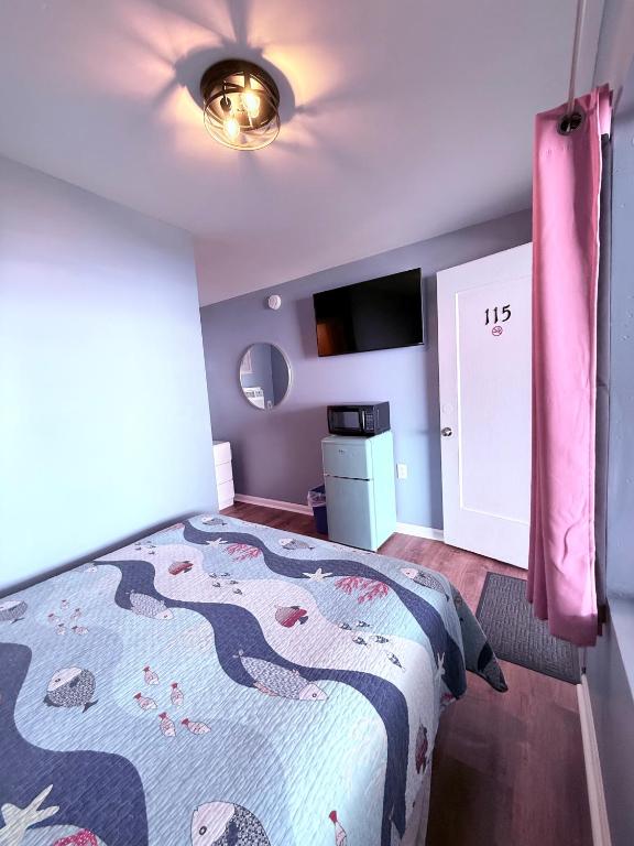 Postel nebo postele na pokoji v ubytování Twilight Motel