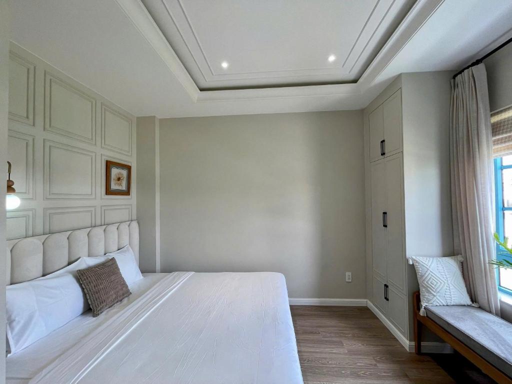 Postel nebo postele na pokoji v ubytování Novaworld Phan Thiết