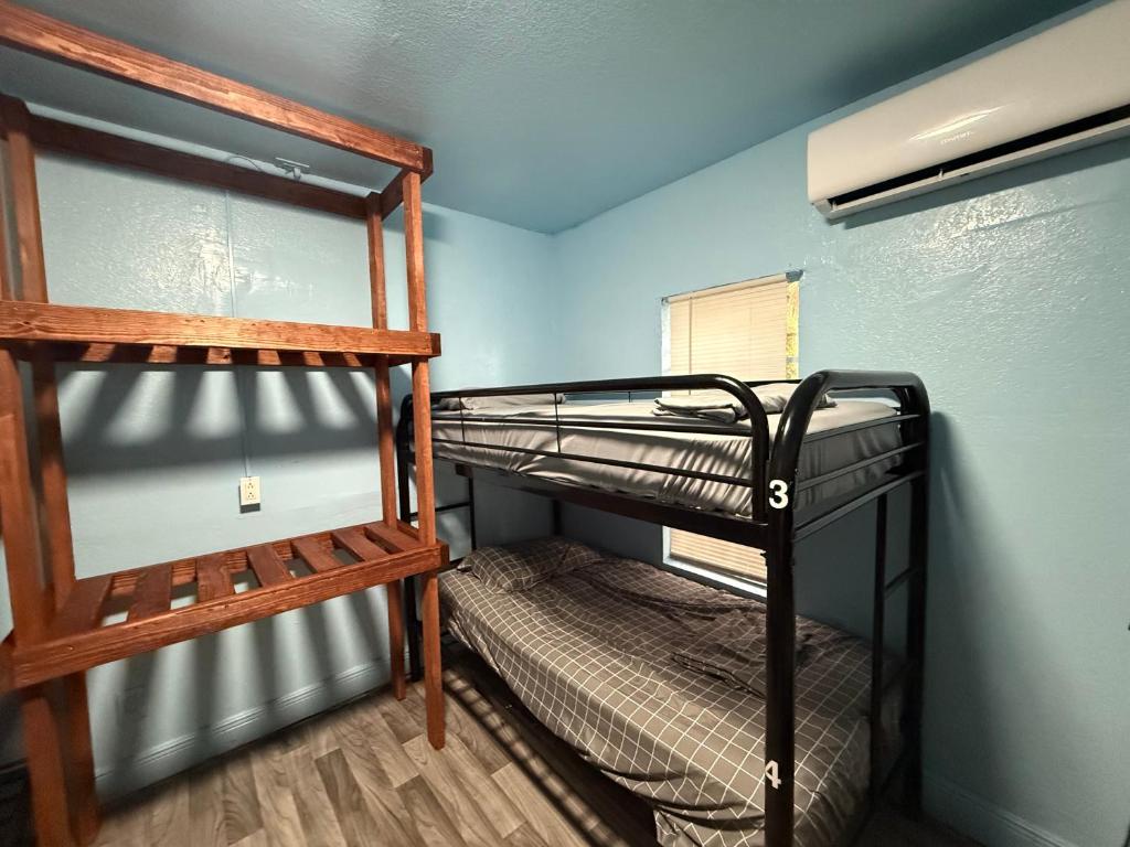 a bedroom with two bunk beds in a room at OQP Vacations in Miami