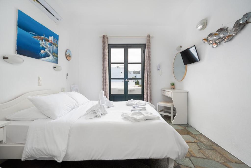 Postel nebo postele na pokoji v ubytování Eleni Rooms