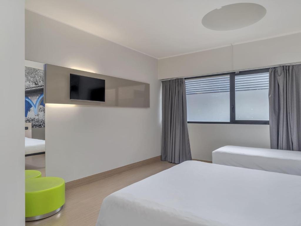 Postel nebo postele na pokoji v ubytování B&B Hotel Como Camerlata
